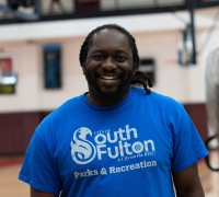 man-smiling-wearing-south-fulton-shirt